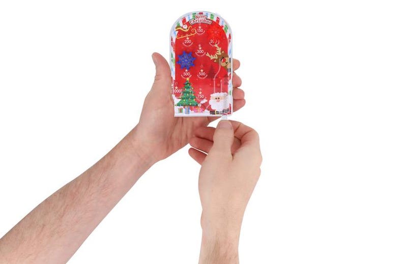 May include: A festive Christmas pinball game with a red backdrop, depicting Santa Claus, a Christmas tree, and a reindeer. The game includes point values and the words "Merry Christmas". The game is held in two hands.