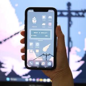 May include: A smartphone with a pixelated background and a custom home screen. The screen displays a message that reads "Rest a while?" with "Yes" and "No" buttons. The phone is held in a hand.