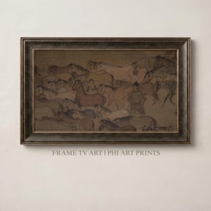 Op de afbeelding: Ingelijste prent van een klassiek schilderij met een kudde paarden in bruin, beige en wit. Een figuur in traditionele kledij staat tussen de paarden. De lijst is donkerbruin. De tekst onderaan luidt "FRAME TV ART I PHI ART PRINTS."