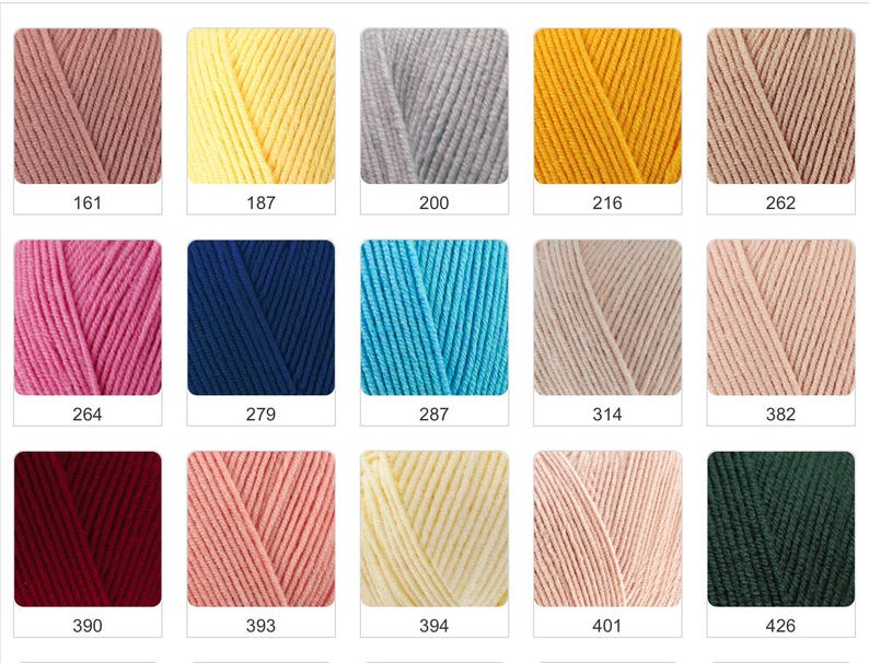 May include: A collection of yarn skeins in various colors, including pink, yellow, blue, and green. Each skein is labeled with a number. The yarn appears to be soft and suitable for knitting or crocheting projects.