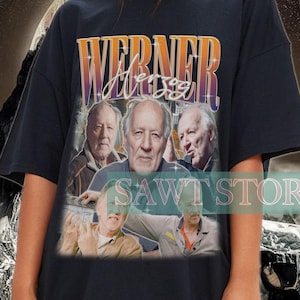 May include: Black oversized t-shirt with a vintage-style graphic print featuring a group of men and the text "Werner Jersey".