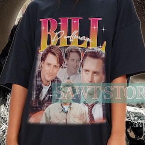May include: Black oversized t-shirt with a vintage-style graphic of the characters from the TV show "Bill Pullman". The graphic features the text "BILL Pullman" in a bold, white font.