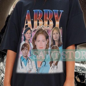ABBY LOCKHART ヴィンテージ シャツ、アビゲイル マージョリー ロックハート T シャツ、医療ドラマシリーズ ER シャツ、アビー ロックハート レトロ 90 年代スタイル T シャツ