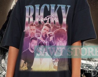 May include: Black oversized t-shirt with a graphic print of Ricky Martin and the text "RICKY Martin" in a neon pink and blue gradient.