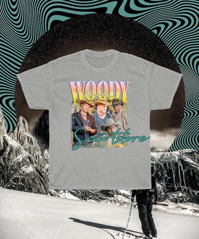 May include: A gray t-shirt with a graphic print of four men wearing cowboy hats. The text "Woody" and "Sante Store" are printed on the shirt.