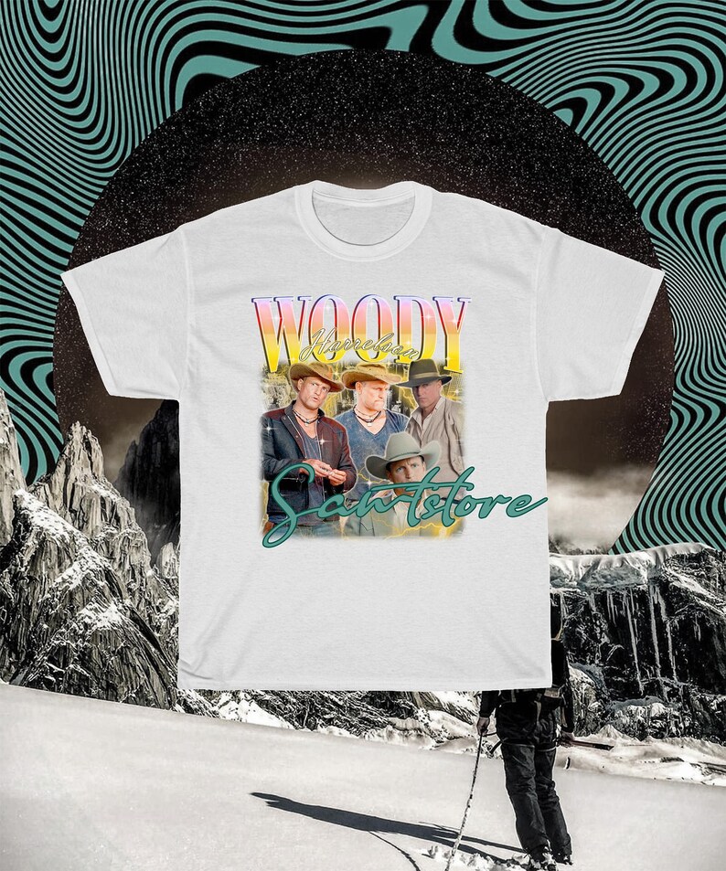 May include: White t-shirt with a vintage-style graphic of a band called "Woody" with the text "Sanstore" underneath.