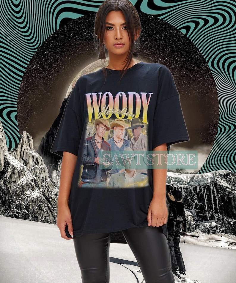 May include: Black oversized t-shirt with a vintage-style graphic of a band called "Woody" with the text "Hurricanes".