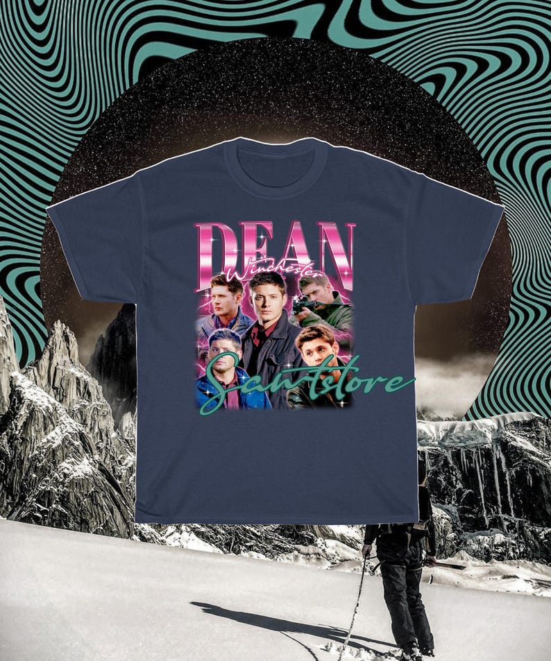 May include: A navy blue t-shirt with a retro-style graphic of Dean Winchester from the TV show Supernatural. The graphic features Dean and other characters from the show, with the text "Dean Winchester" and "Samstore" in pink and green.