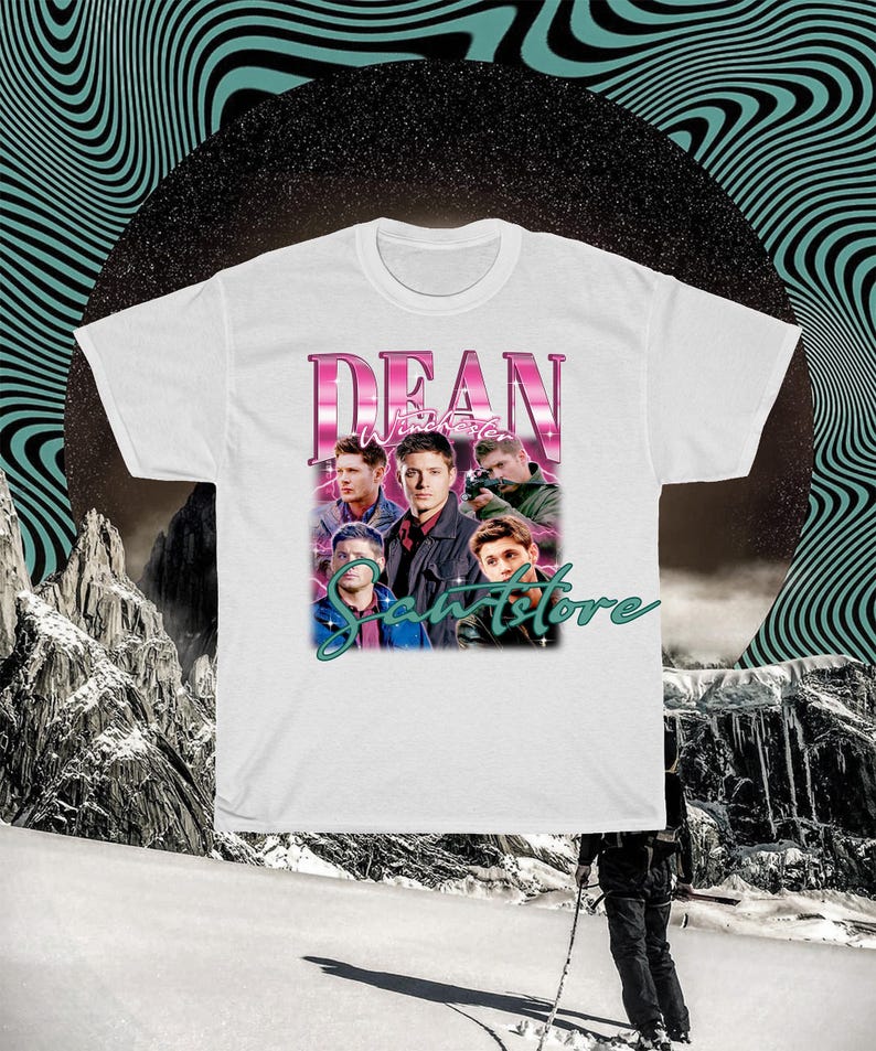 May include: White t-shirt with a pink graphic print of the characters from the TV show "Supernatural". The graphic features the text "Dean Winchester" and a group of men in a band.
