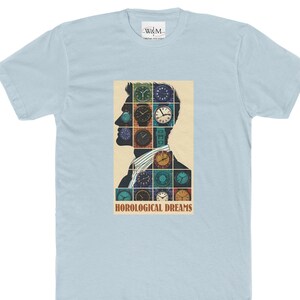 May include: A light blue t-shirt with a graphic of a man's silhouette with various colorful clocks covering his head. The text "HOROLOGICAL DREAMS" is printed below the graphic.