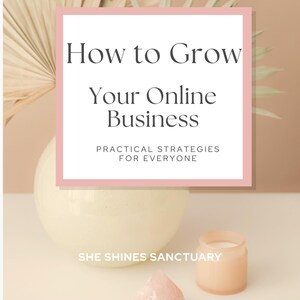 May include: A still-life composition featuring a cream-colored vase, a pink crystal, and a small candle in a glass jar. The text "How to Grow Your Online Business" is displayed in a pink-bordered white rectangle. Dried palm leaves are in the background.