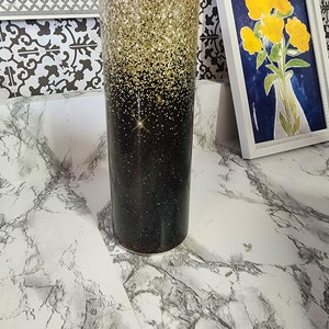 Zwart en goud glitter tuimelaar