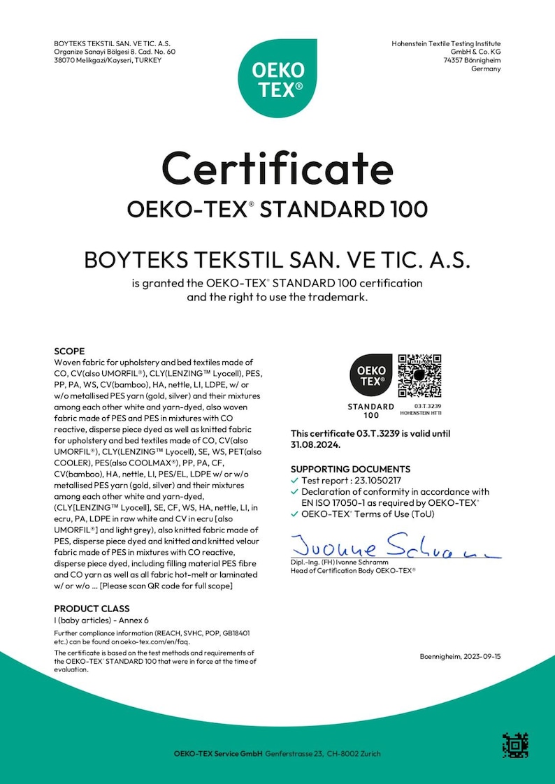 May include: A white certificate with the OEKO-TEX Standard 100 logo, issued by Hohenstein Textile Testing Institute. The certificate, valid until August 31, 2024, confirms the textile's safety for baby articles. The document includes supporting documents and a QR code.