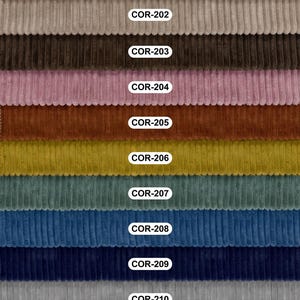 May include: A selection of corduroy fabric swatches in a range of colours, each identified with a "COR" code. The colours include cream, grey, brown, pink, orange, yellow, teal, blue, and dark grey. The fabric has a ribbed texture.