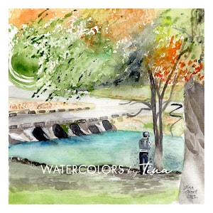 May include: Watercolor painting of a serene landscape featuring a bridge over a turquoise river, surrounded by trees with green and orange foliage. The text "WATERCOLORS by Tina" is visible. A person is standing near the river. Signed "Tina Ornell 2022".
