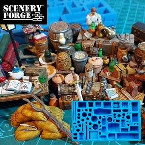 Könnte beinhalten: Eine blaue Silikonform mit verschiedenen Formen zum Erstellen von Miniaturgegenständen. Die Form befindet sich neben einer Sammlung von Miniaturfässern, Kisten und anderen Gegenständen aus Holz, darunter ein kleines Schwert und ein Buch.