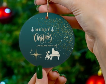 May include: A green and gold Christmas ornament with the text "Merry Christmas and Happy New Year" and a silhouette of a person playing a piano.