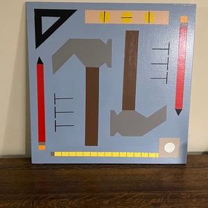 May include: A blue background with various tools, including a hammer, a ruler, a pencil, a level, and a triangle. The tools are painted in different colors, including red, yellow, brown, black, and gray.