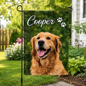 May include: A rectangular garden flag featuring a portrait of a golden retriever with its mouth open and tongue out. The name Cooper is printed in white cursive script at the top, accompanied by two white paw print icons on the right side.