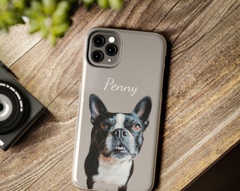 May include: A gray phone case with a black and white photo of a dog with the name "Penny" printed on it.