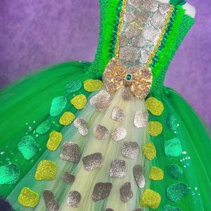 May include: A set of three ceramic mugs with a speckled, matte finish. The mugs are in shades of cream, light gray, and dark gray. Each mug has a simple, minimalist design, perfect for coffee or tea.