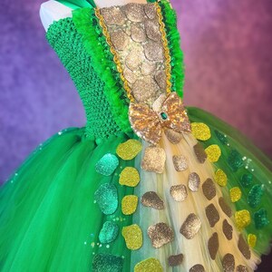 May include: A white ceramic mug with a black handle and the text "But First, Coffee" in a black, bold font. The mug is on a white surface.