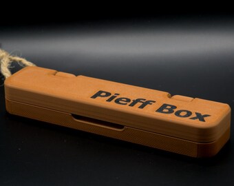 May include: A wooden box with a rope handle and the text "Piff Box" engraved on the top.