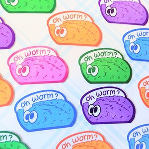 May include: A set of ten colorful stickers featuring cartoon worms with the text "Oh worm?" in a playful font. The stickers are printed on white paper and have a glossy finish.