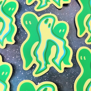 May include: A set of green and yellow ghost stickers. The ghosts are outlined in black and have a cartoonish style.