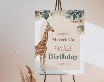 May include: A welcome sign for a birthday party with a giraffe wearing a green party hat. The sign is decorated with green and brown tropical leaves and has the text "Welcome to Maverick's Wild Birthday April 27th, 20XX".