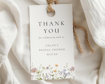 May include: A white gift tag with the words "THANK YOU" in black, with the text "for celebrating with us" below. The tag is for "Chloe's Bridal Shower" and has a floral border with a twine string.