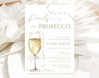 May include: A white bridal shower invitation with gold text that reads "Pearls and Prosecco". The invitation features a watercolor illustration of a champagne flute with a pearl necklace draped around it. The invitation includes details for a bridal shower honoring Claire Murphy, including the date, time, location, and RSVP information.
