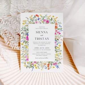 May include: A wedding invitation with a floral border featuring colorful watercolor flowers. The invitation includes the names "Sienna and Tristan" and event details. The text reads "Request the honor of your presence at their wedding celebration" and the date and time.