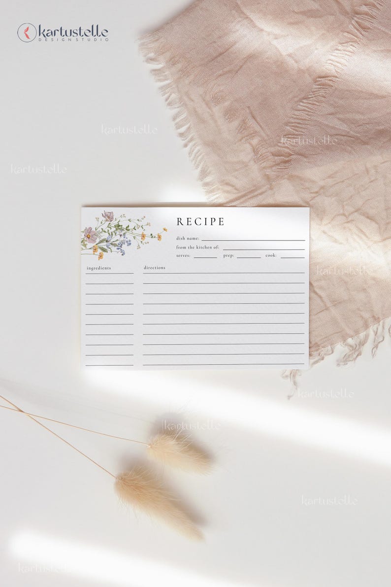 May include: A recipe card with floral accents and the word "RECIPE" at the top. The card has lines for ingredients and directions. The card is white with a floral design in the upper left corner.