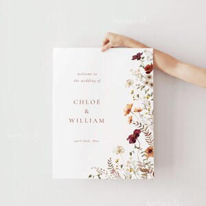 May include: A wedding announcement with a floral design. The announcement says "Welcome to the wedding of Chloe & William, April 26th, 20xx".