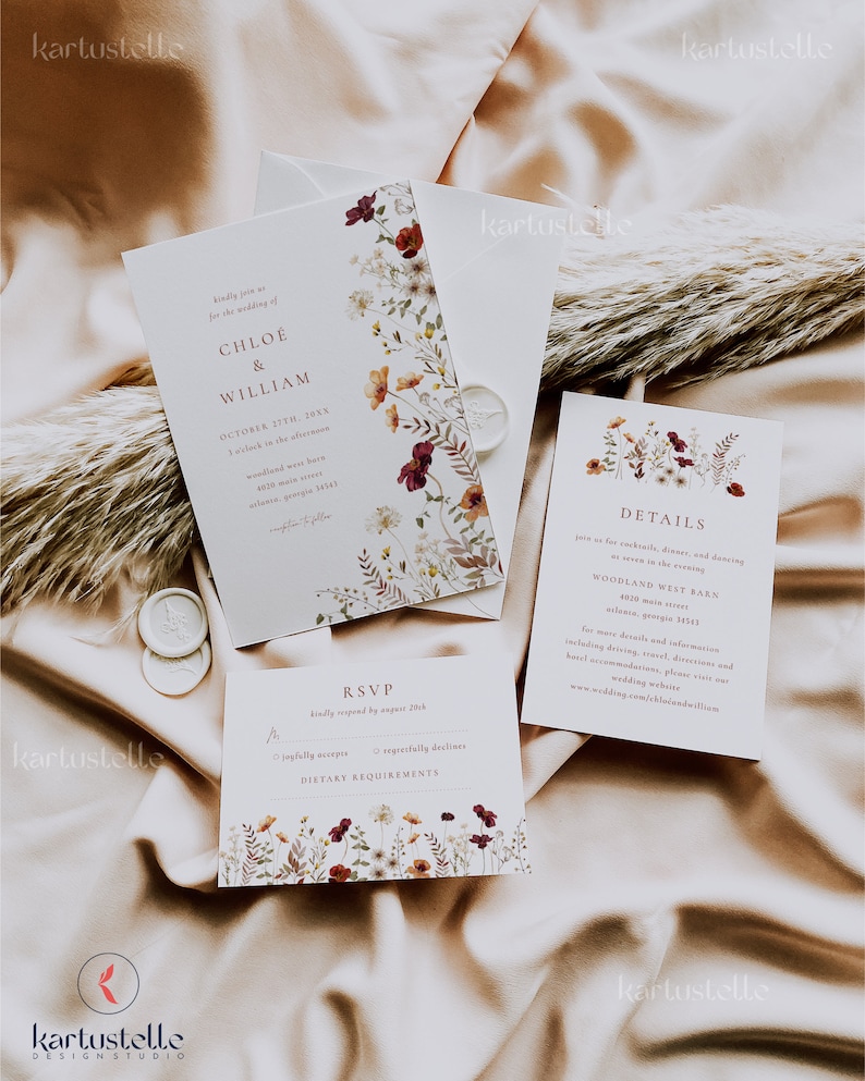May include: A wedding invitation suite with a floral design. The invitation features a white background with burgundy and orange flowers. The RSVP card has a similar design and includes a section for dietary requirements. The details card has a white background with a floral design and includes the wedding date, time, and location.