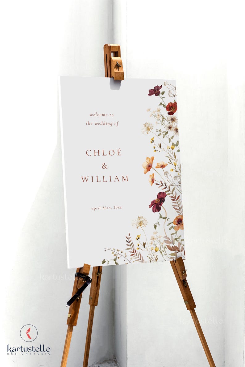 May include: A white wedding welcome sign with a floral border. The sign reads "Welcome to the wedding of Chloe & William, April 26th, 20xx".