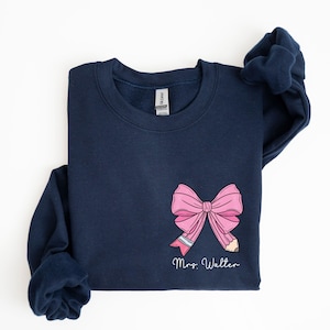 custom name teacher pink coquette bow pencil sweatshirt with pocket size design