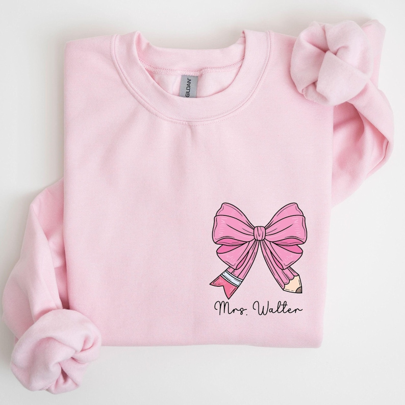 custom name teacher pink coquette bow pencil sweatshirt with pocket size design
