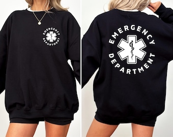 May include: Black sweatshirt with a white graphic of a medical symbol and the text "Emergency Department".