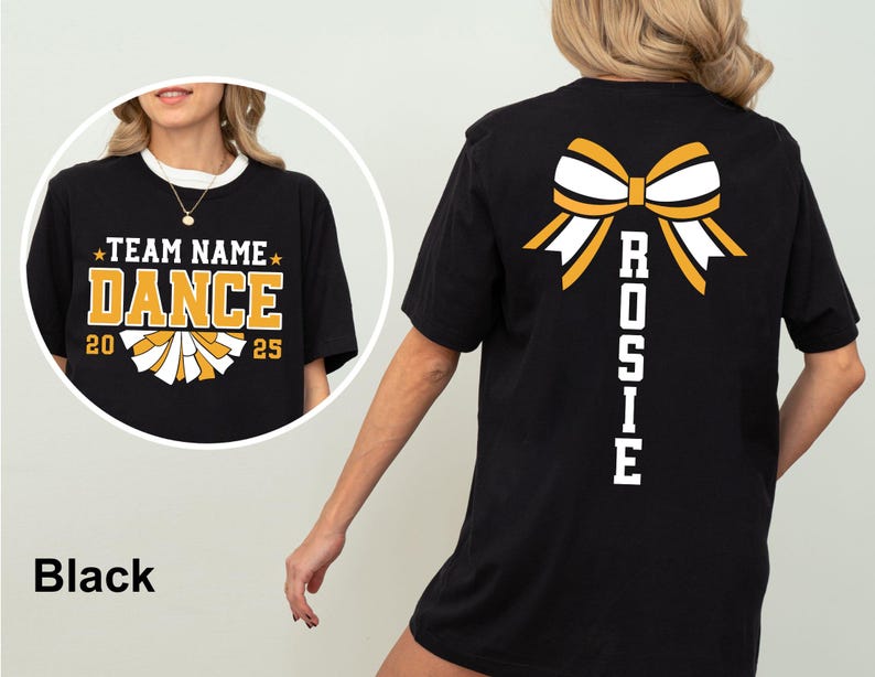 May include: Black t-shirt with a white collar featuring a gold and white bow design on the back. The front of the shirt has the text "TEAM NAME DANCE 20 25" in gold and white. The word "Rosie" is printed vertically on the back.