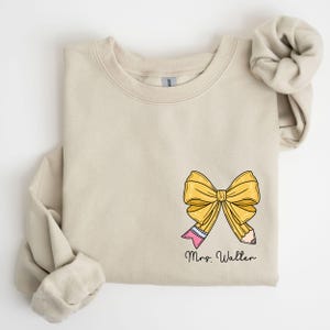 a t - shirt with a bow on the front of it