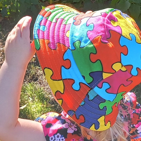 Colourful puzzle-print toddler bucket hat style sun hat for girls and boys