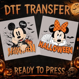 May include: Two DTF transfer designs featuring cartoon mice characters for Halloween. One shows a mouse with a skeleton shirt, bats, and pumpkins. The other shows a mouse with an orange polka dot bow and spiderweb. Both include the text Halloween.