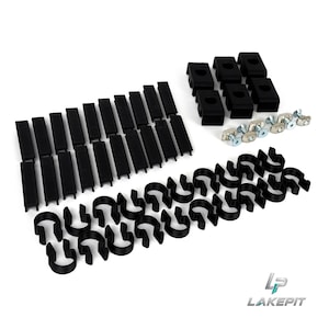 May include: A collection of black plastic hardware components including twenty rectangular slotted covers, six square mounting blocks, and four silver metal T-bolts. The set is arranged on a white surface with the LakePit logo in the bottom corner.