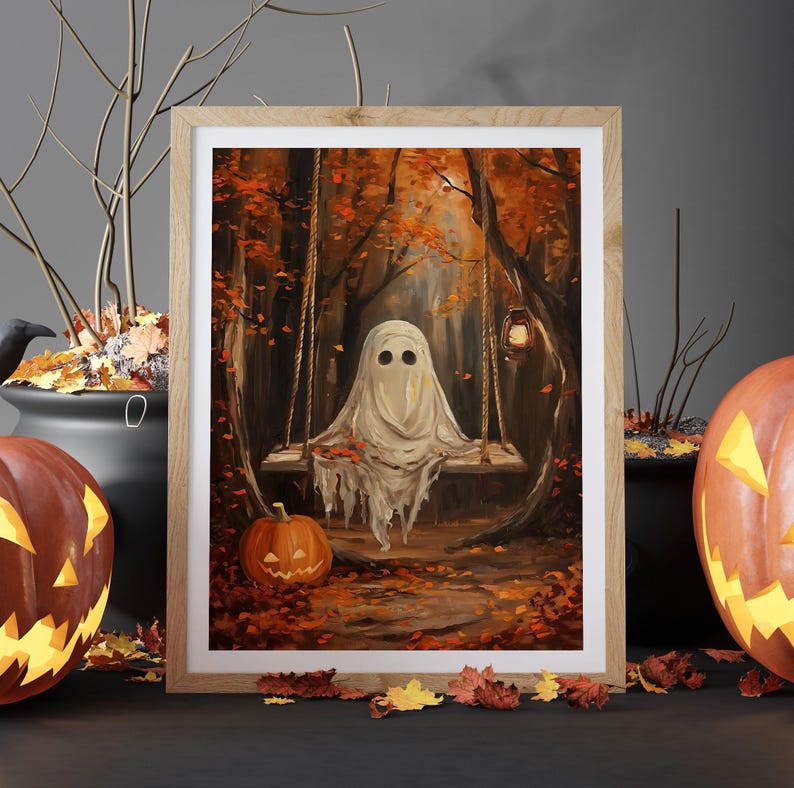 May include: A framed Halloween-themed painting depicts a ghost on a swing in a forest with autumn foliage. A carved pumpkin and a cauldron are on either side of the frame. The painting has a warm color palette of orange, brown, and beige.