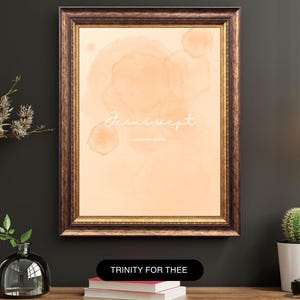 May include: Framed art print with a watercolor-style background in peach tones. The text "Jesus wept" is written in a delicate script. The frame is a dark brown with gold accents. The print is displayed on a wooden surface.