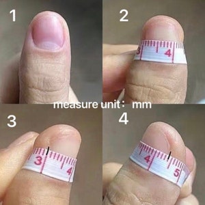 May include: Four images showing a person's thumb with a measuring tape wrapped around it. The images show the thumb at different angles and with the tape measure at different positions. The text "measure unit: mm" is visible below the images.