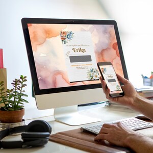 May include: A computer screen and a smartphone display a digital card with a watercolor floral design and the text "Die beste Gl&uuml;ckw&uuml;nsche zur Geburt von Erika".
