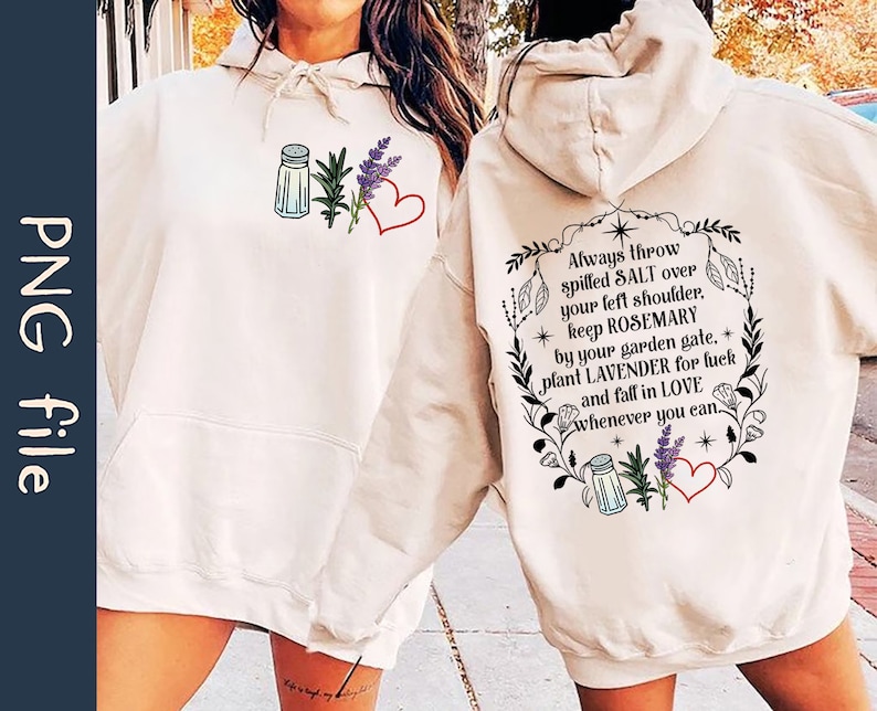 May include: A white hoodie with a graphic design featuring a salt shaker, rosemary, lavender, and a heart. The text reads "Always throw spilled SALT over your left shoulder, keep ROSEMARY by your garden gate, plant LAVENDER for luck and fall in LOVE whenever you can."